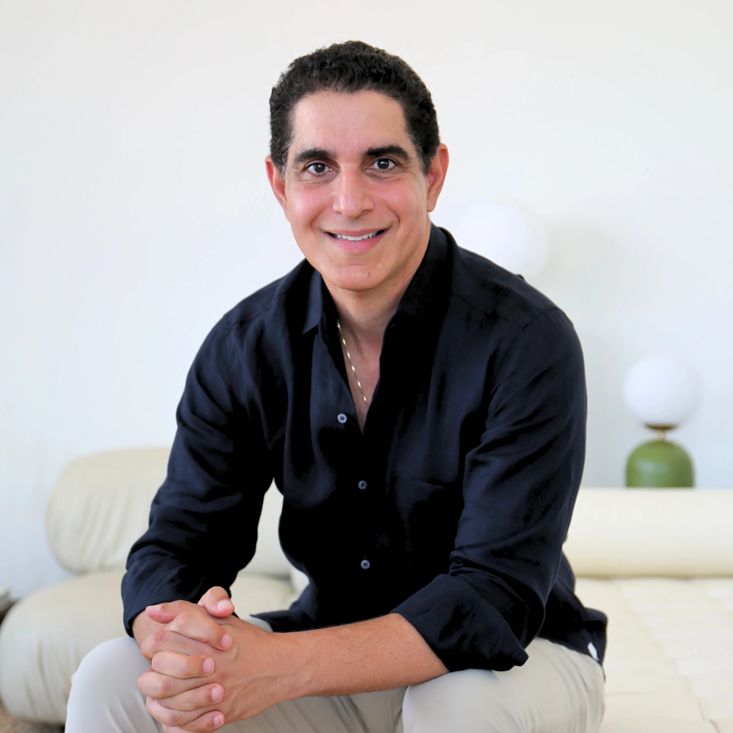 Dr. Dan, Wellbel's cofounder, seated in a bright living room